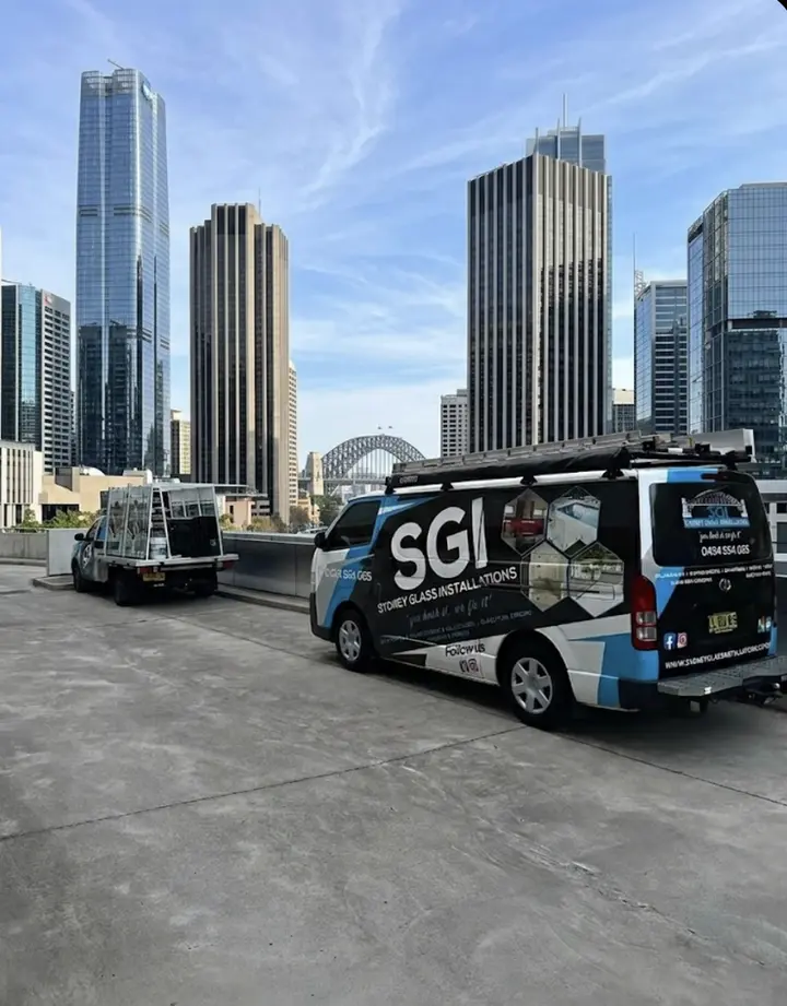 Sydney Glass Installations branded van in front of the Sydney Harbour Bridge and CBD skyline